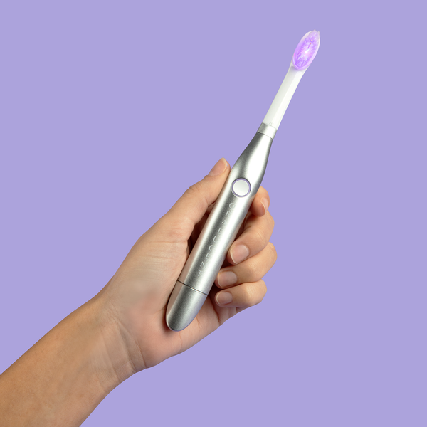 Oralucent Pro Edition light therapy sonic toothbrush with the LED illuminated